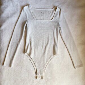 Target Women's Long Sleeve Ribbed Slim Fit Bodysuit A New Day™ in Cream | Size S